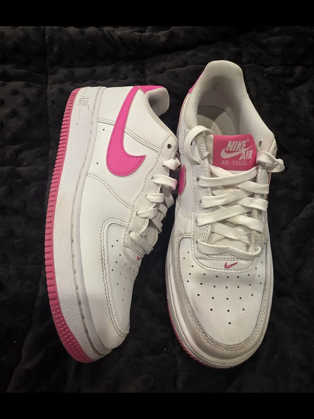 Nike Air Force 1 White Low-Top with Bright Pink Swoosh and Outsole.
